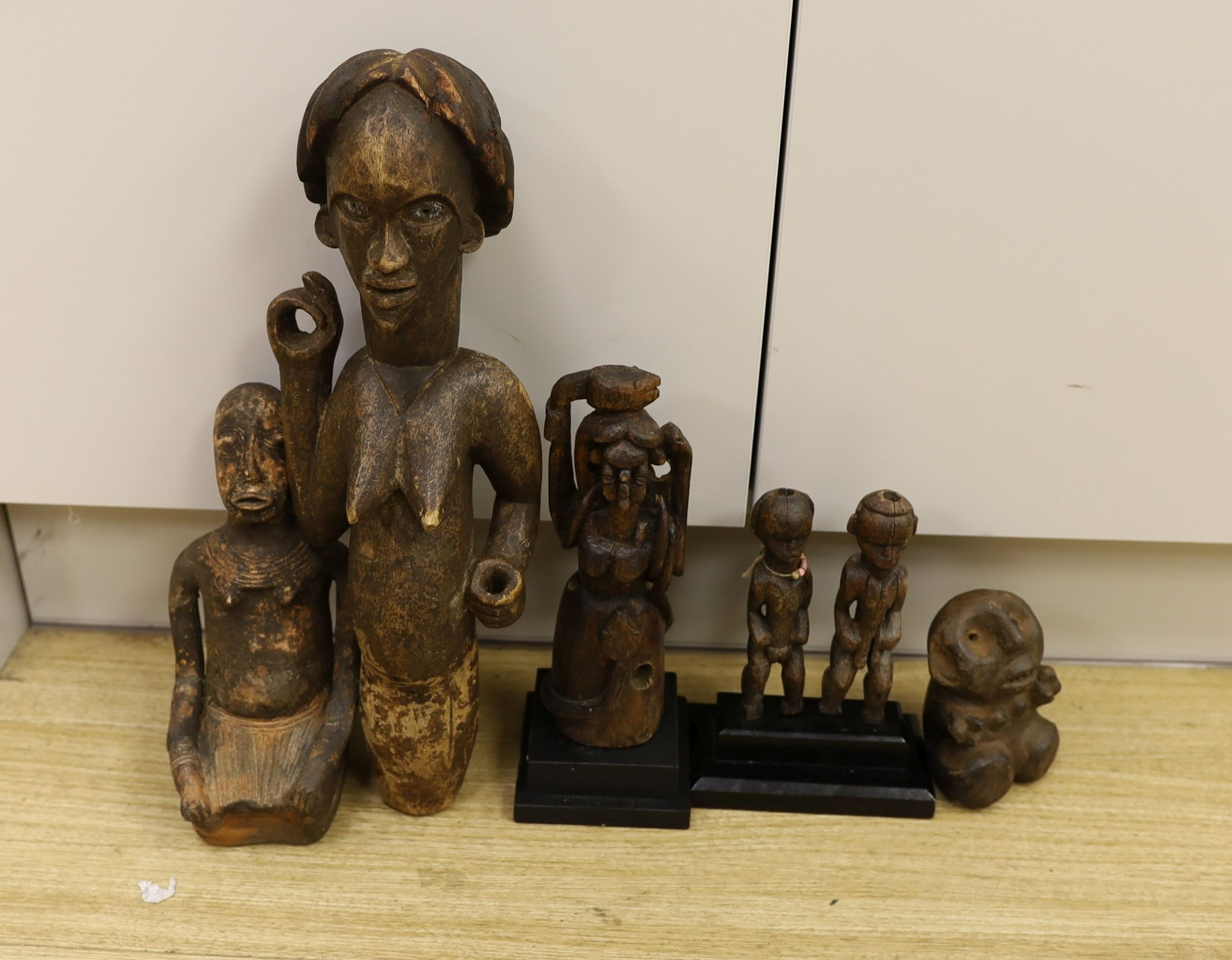 A large quantity of African wood carvings, gourd water carriers, etc.